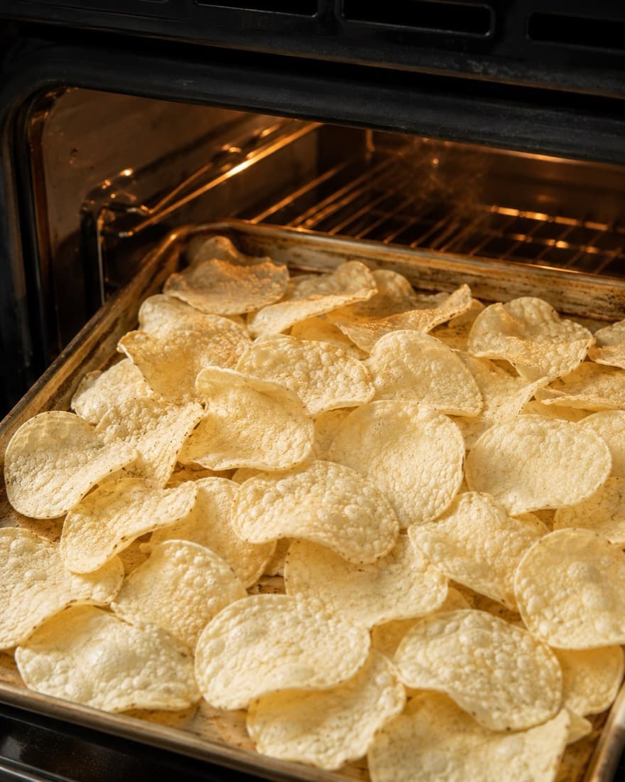 HandCut chips on a tray in an oven