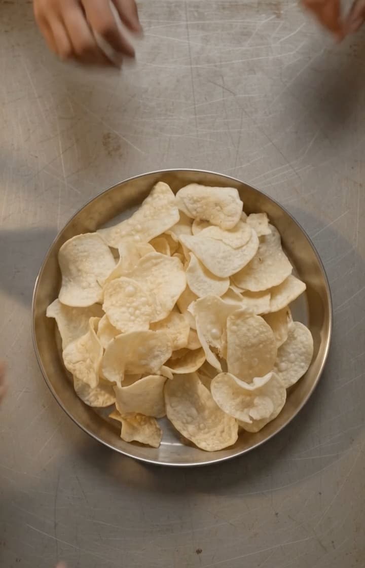 A family sharing a bowl of HandCut chips
